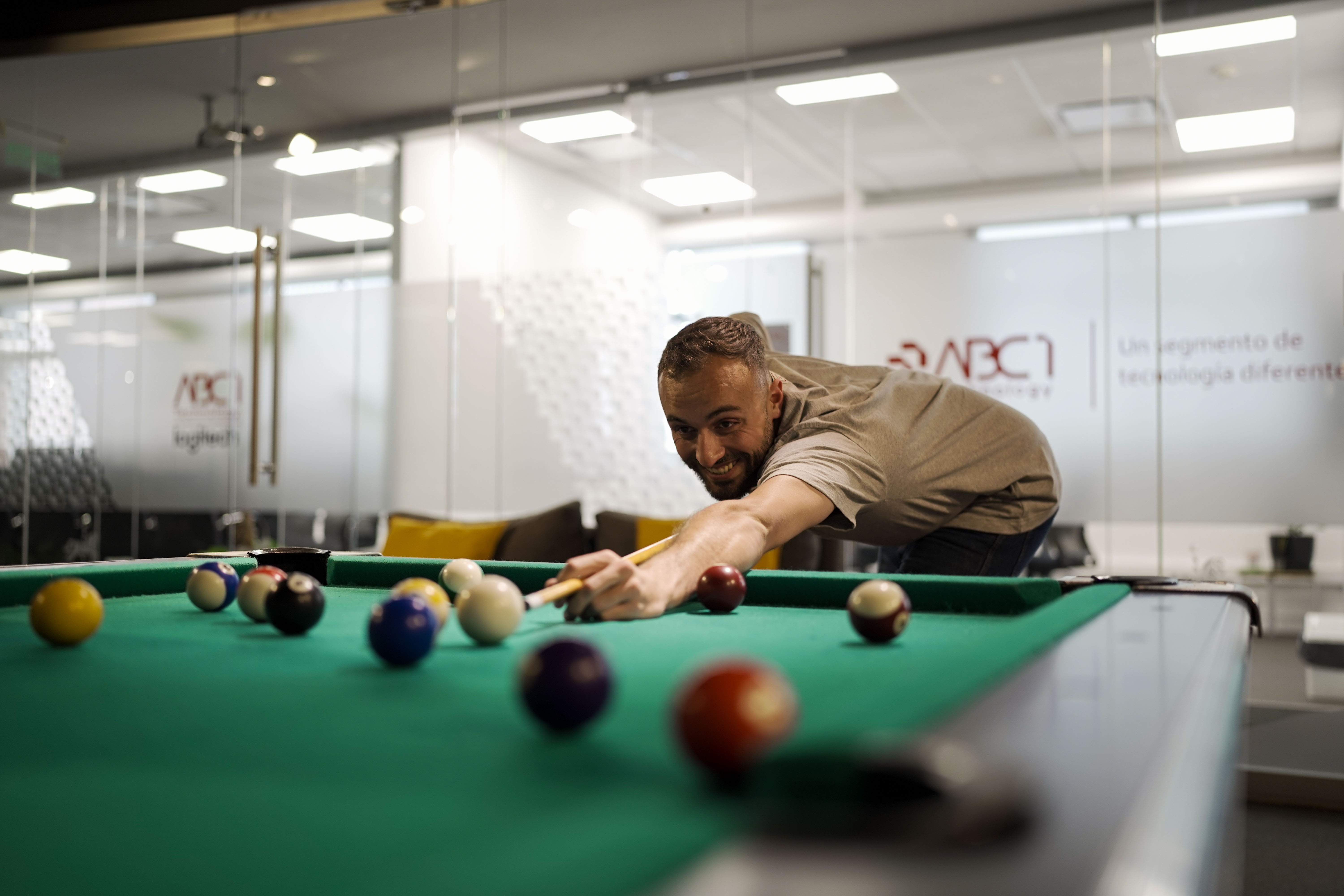 three men sitting on chair beside tables