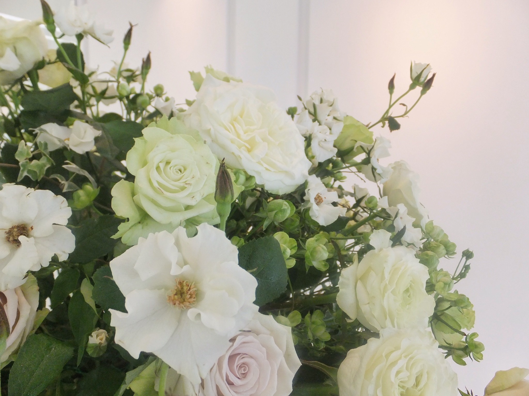 three white taper candles