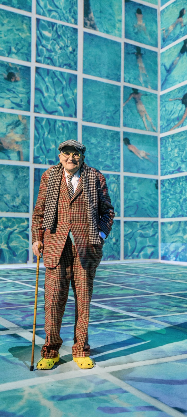 Two hands in an elegant gesture, one above the other, against a dark background