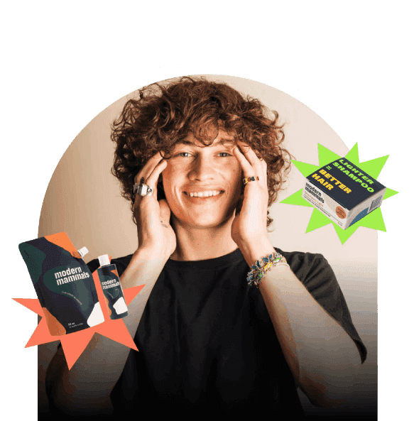 boy with long hair haing hands on face