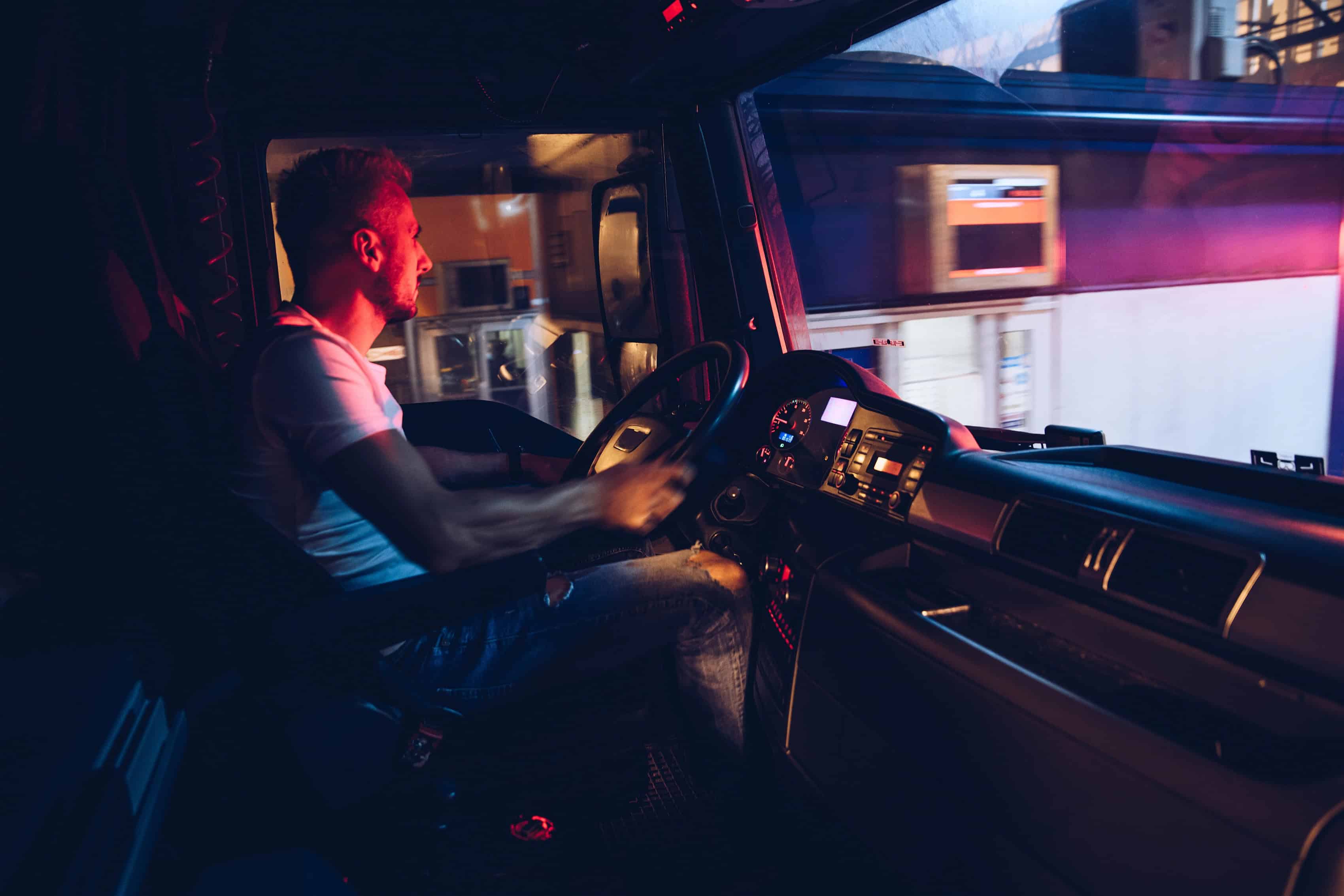 Night-shift truck driver dealing with fatigue and needing to stay vigilant and alert to miss critical cues