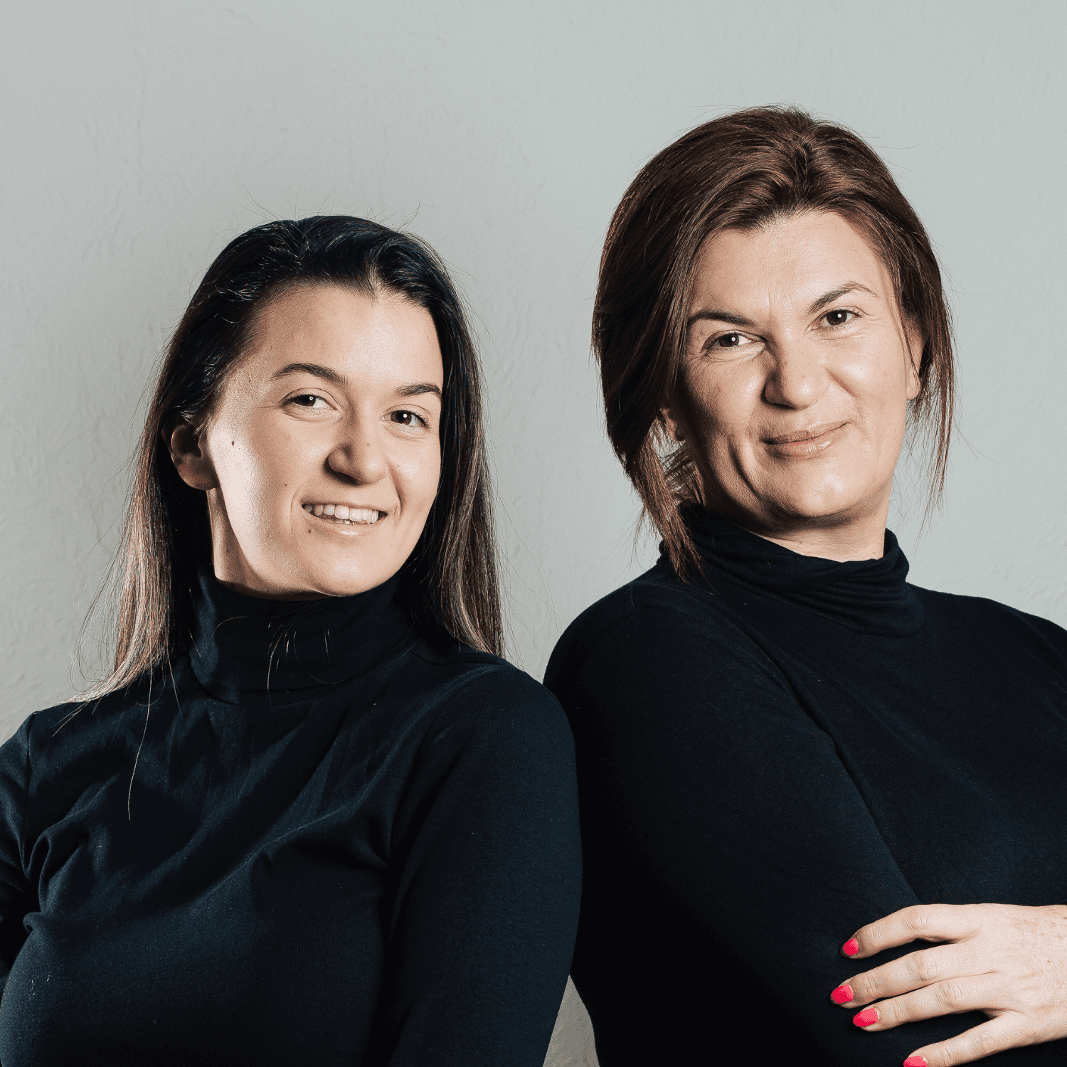 professional photo of two women standing together
