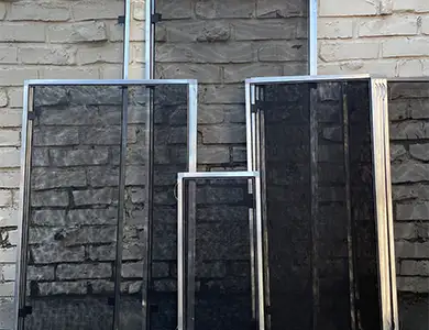 Window screen frame and spline on a workbench, showing our screen assembly process.