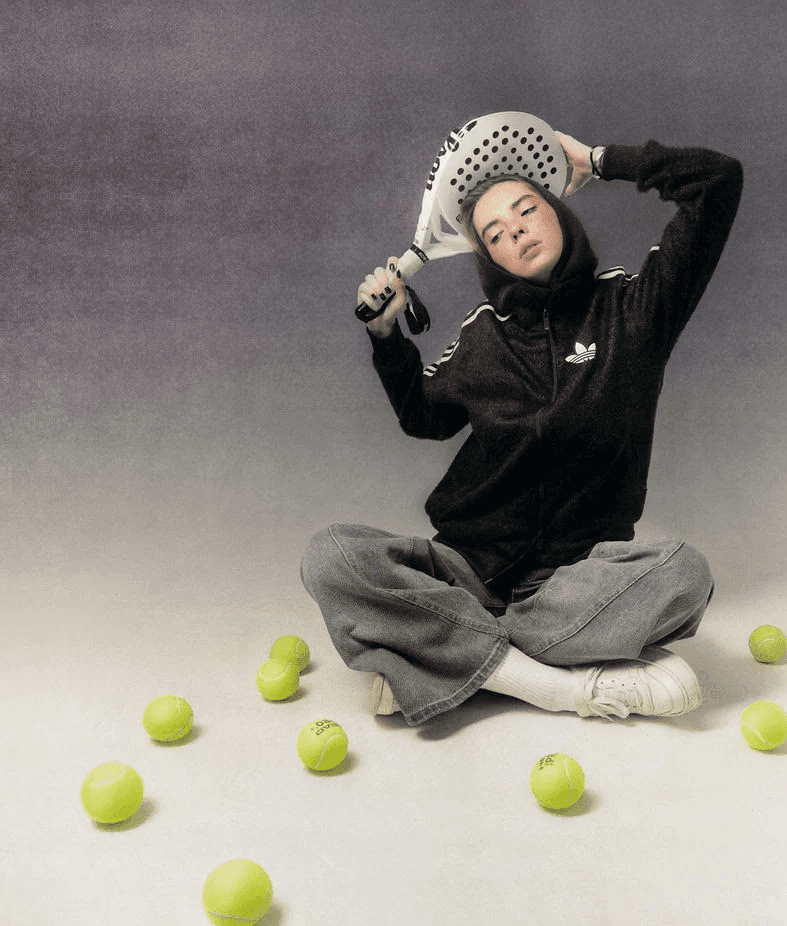 two tennis rackets and balls on a blue tennis court