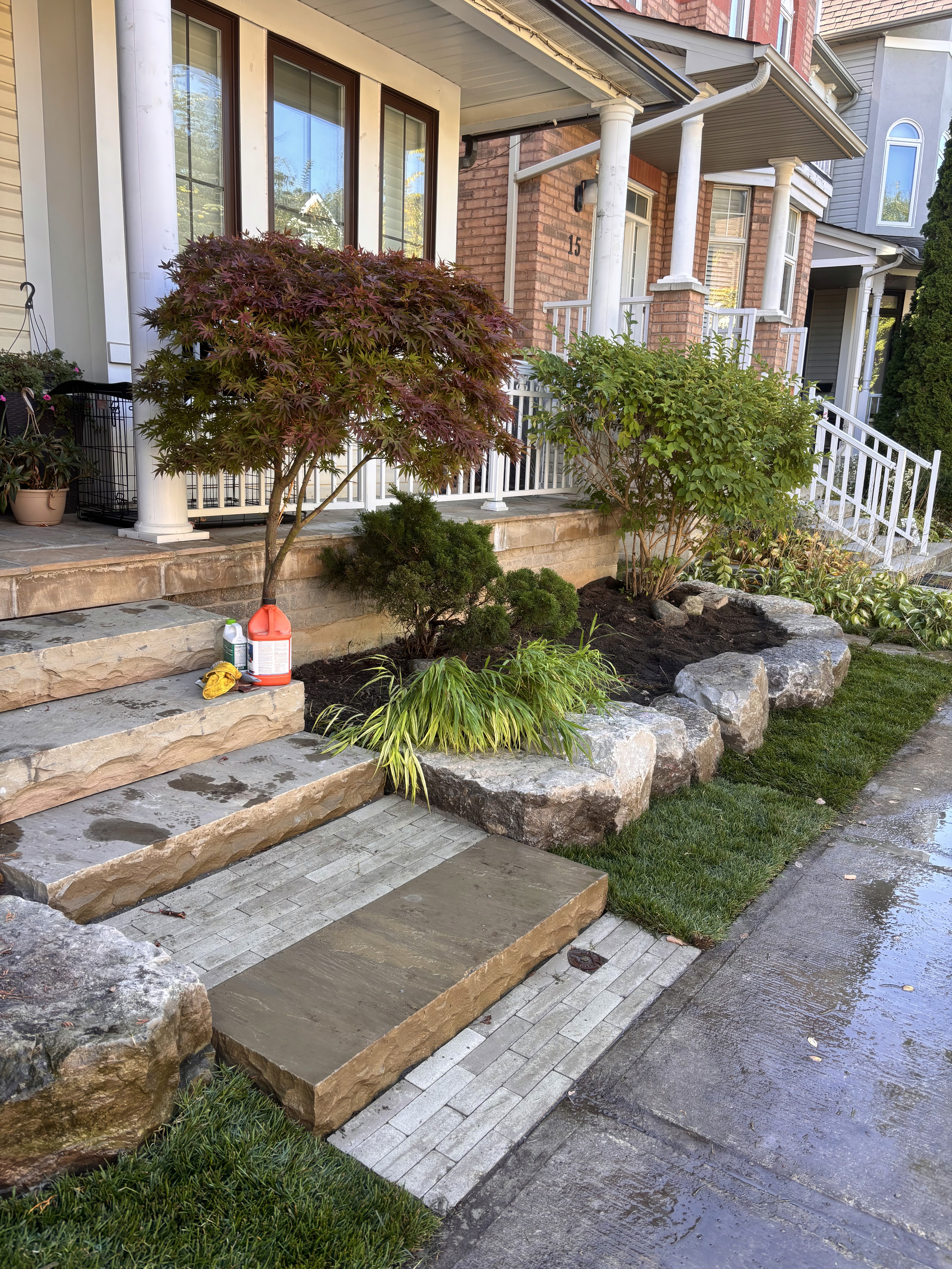 Stone steps with fresh landscaping and sod