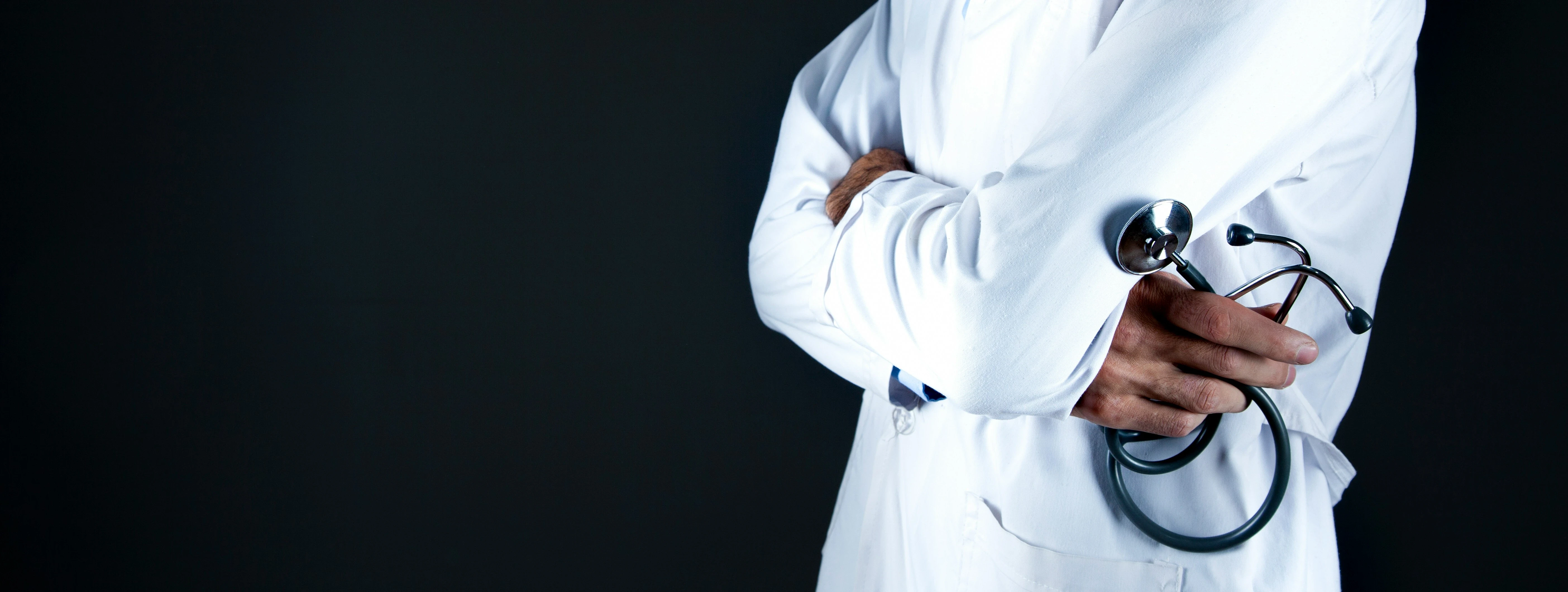 personal injury doctor wearing a white robe