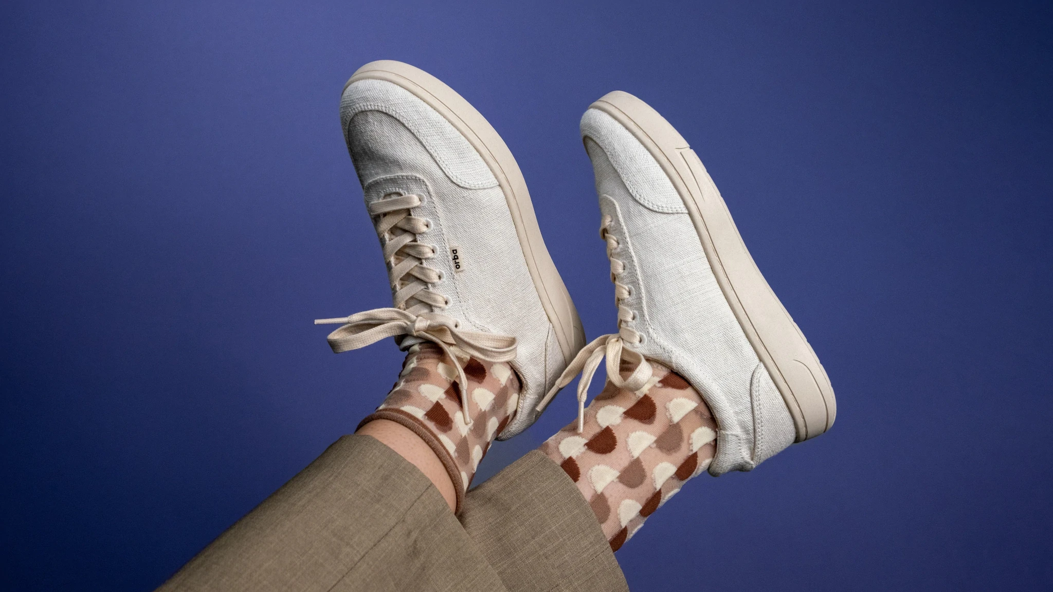 Orba plant-based Ghost sneakers and goovy socks.