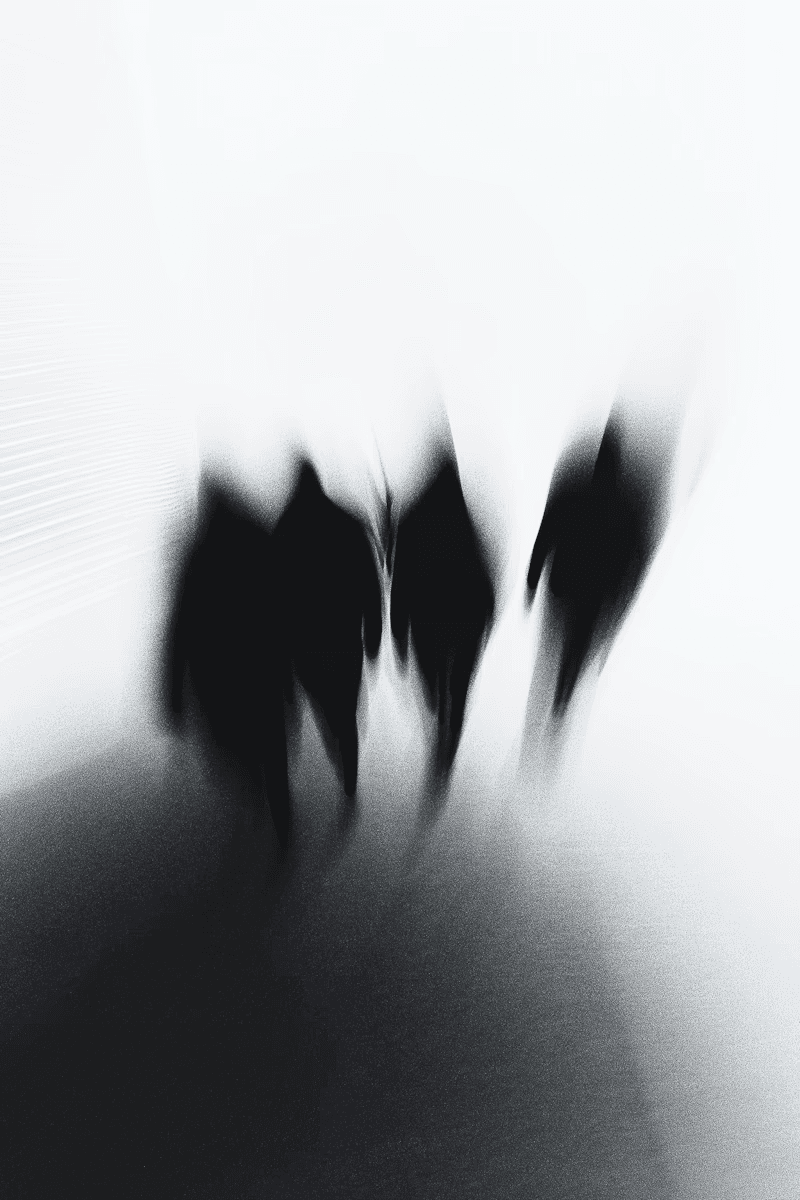 Abstract image of blurred silhouettes of four figures in motion