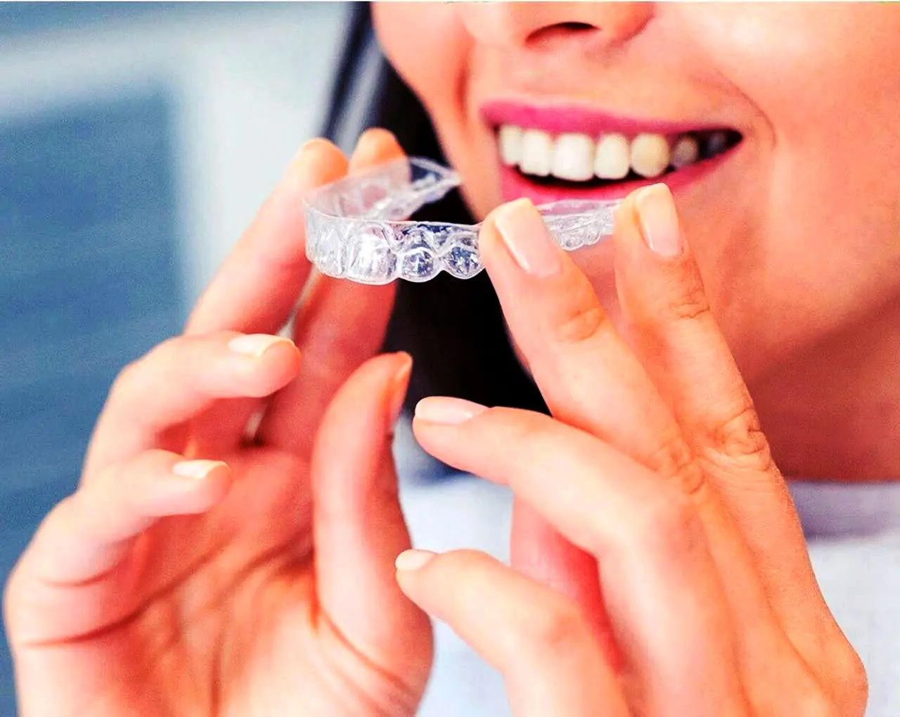 Woman holding Invisalign