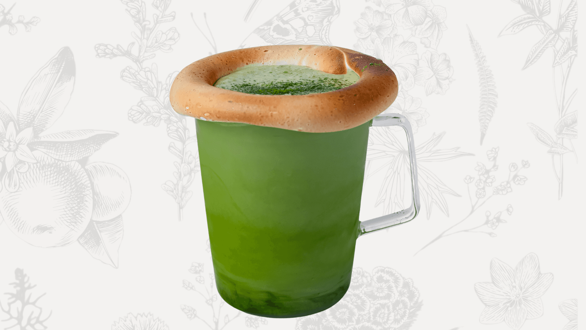 A cup of creamy matcha drink made with white chocolate and milk, topped with toasted marshmallow.