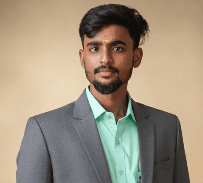 a man in a suit and tie posing for a picture