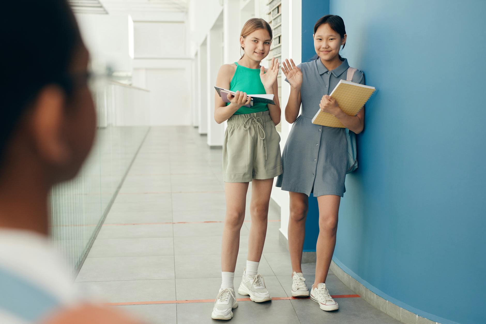 A young student wearing a virtual reality headset exploring a futuristic digital library through utopia education.