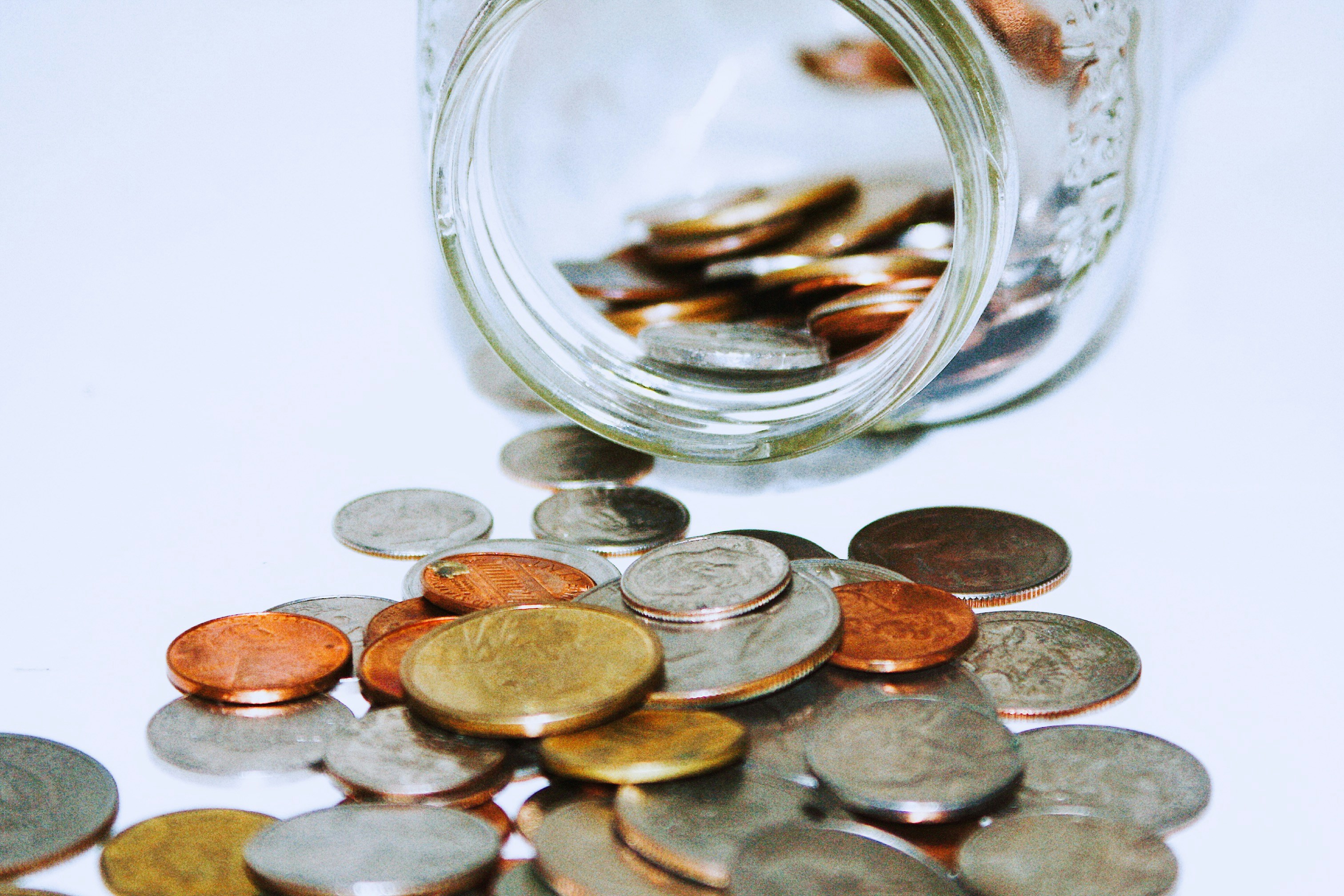 a glass jar of coins