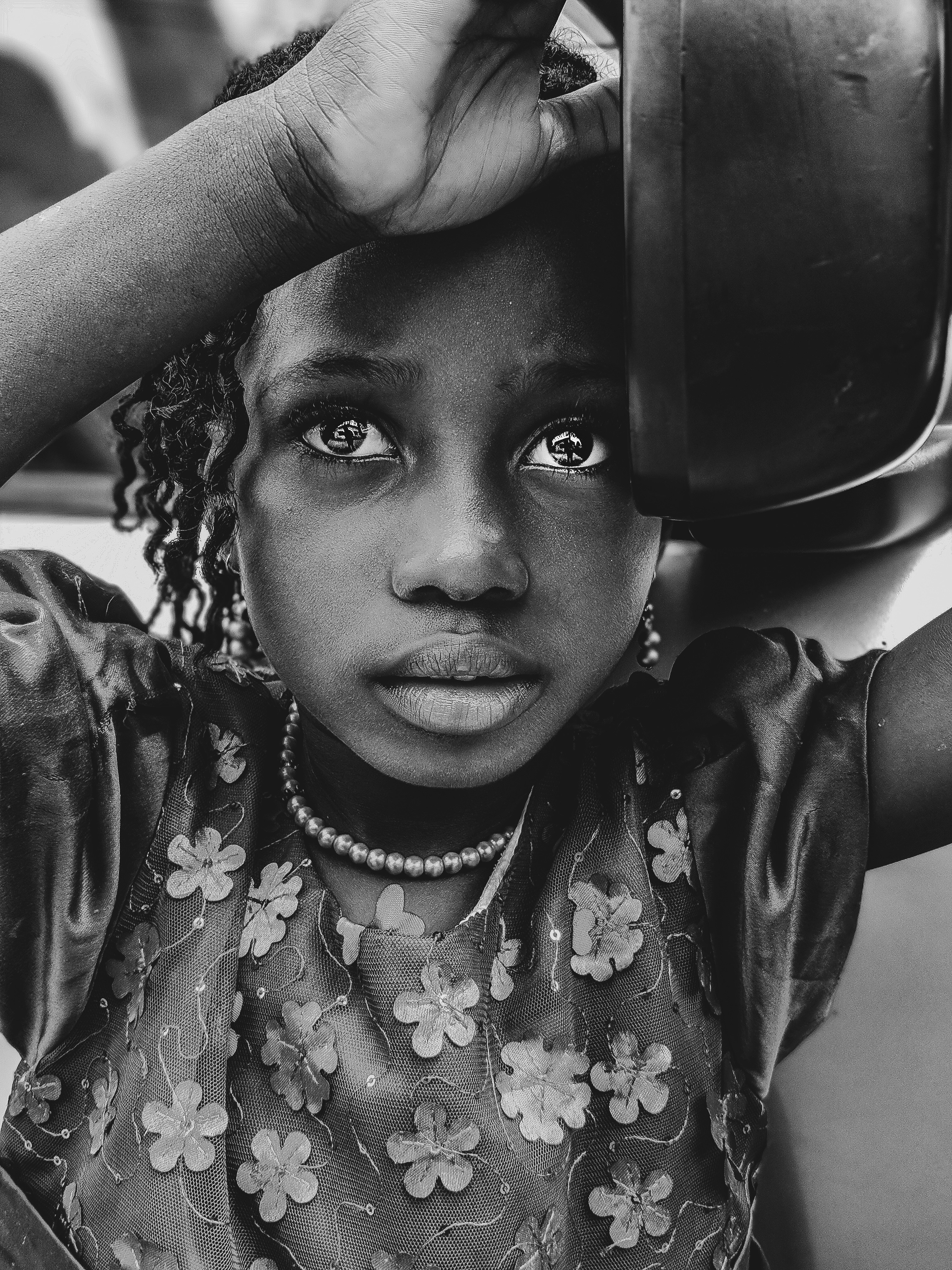 girl holding bowl on grayscale photography