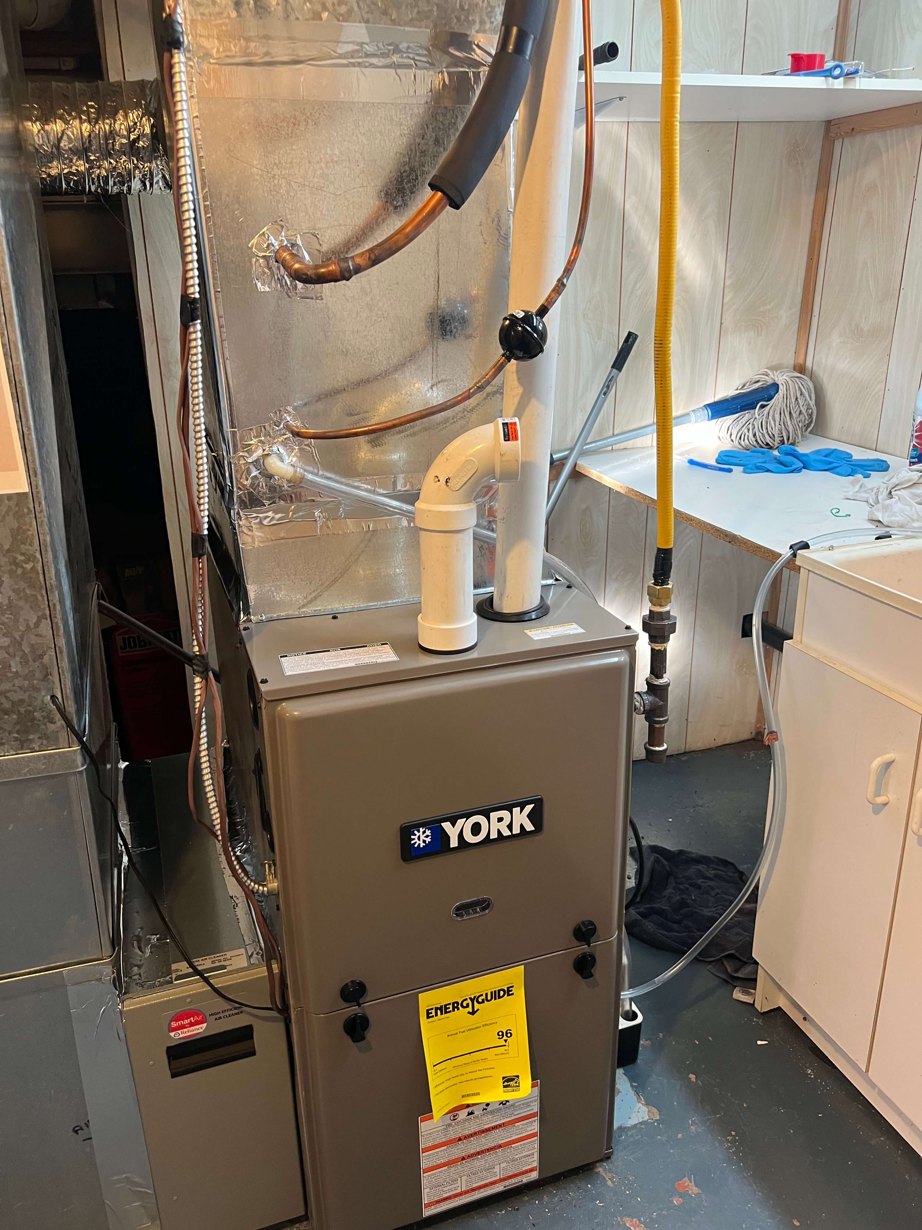 furnace being installed in a basement of a home in mississauga