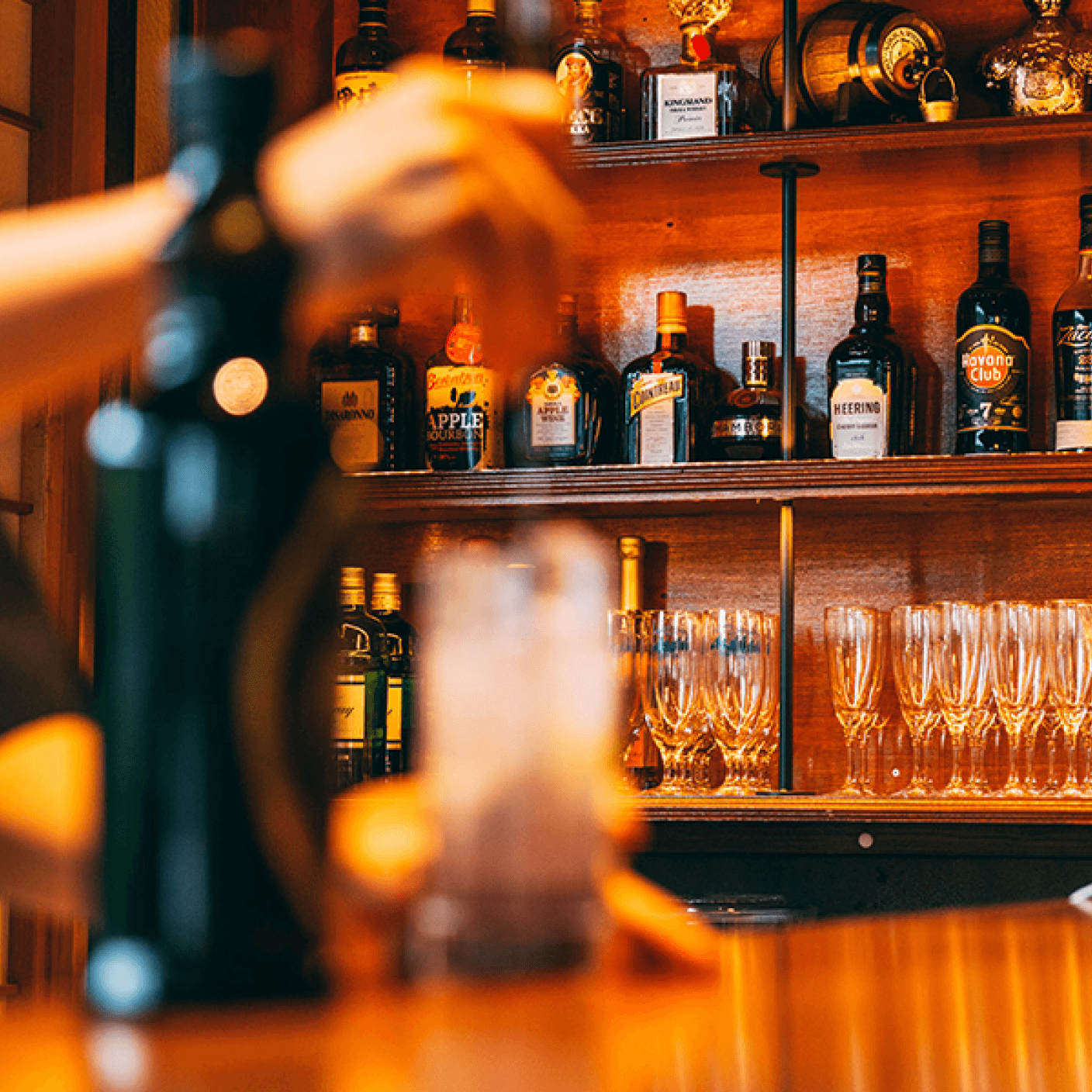 A bar with many selections of alcohol