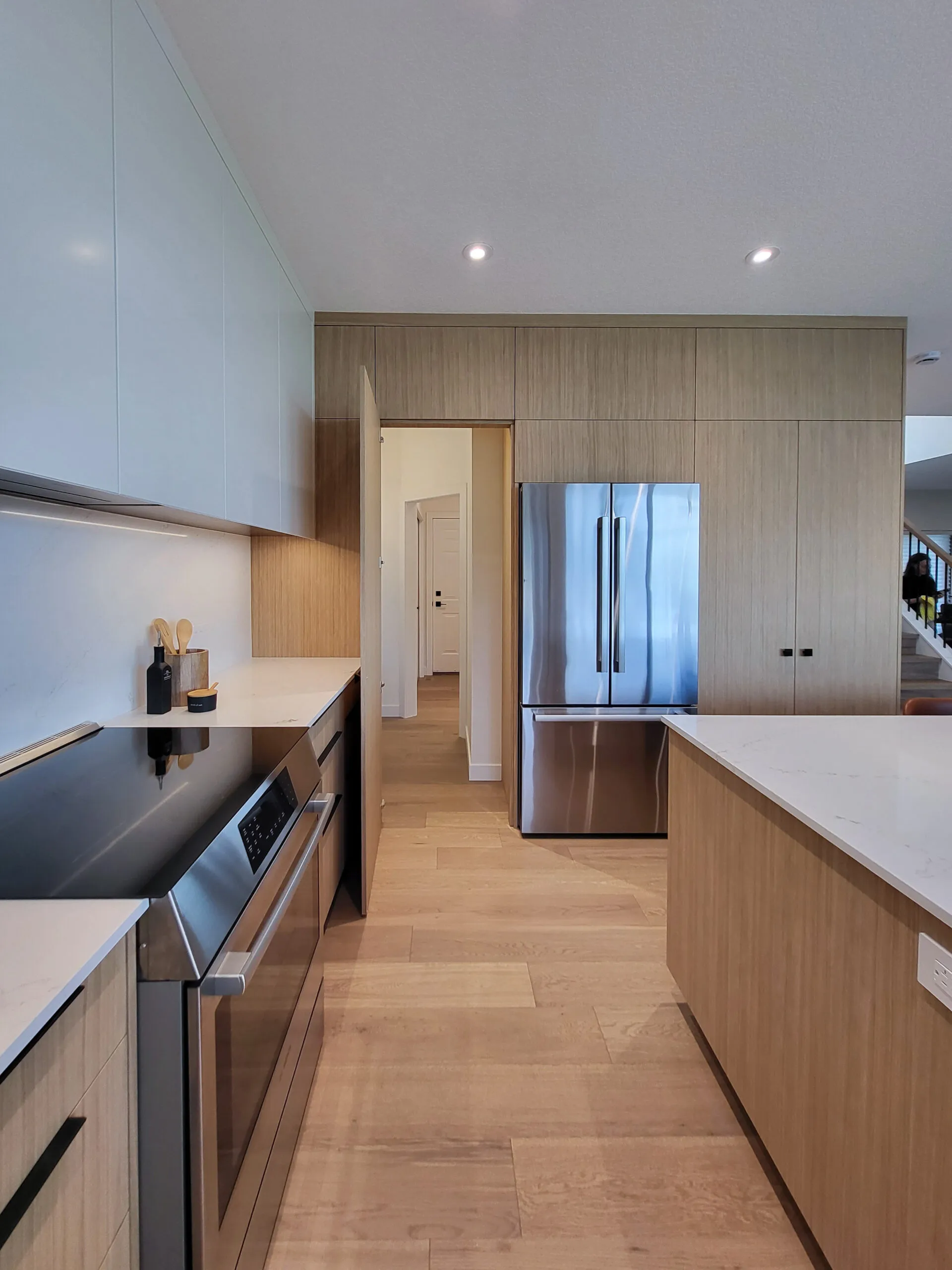 Image of large passthrough pantry and wall pantry.