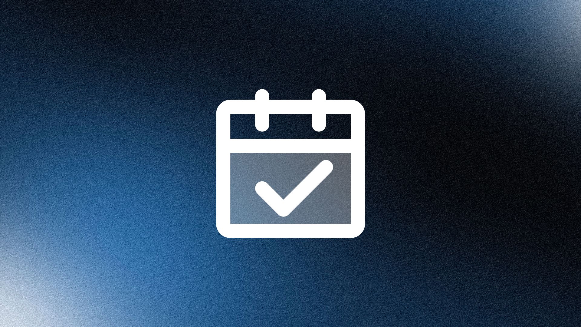 Man wearing a beige cap and dark shirt working on a laptop at a wooden desk with a plant in the background.