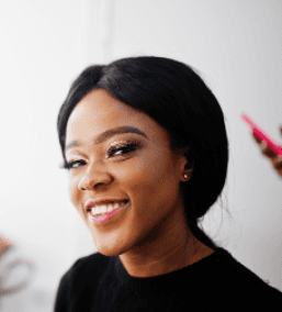 Smiling Nigerian woman symbolizing trust, identity verification, and digital safety with Profiled Nigeria