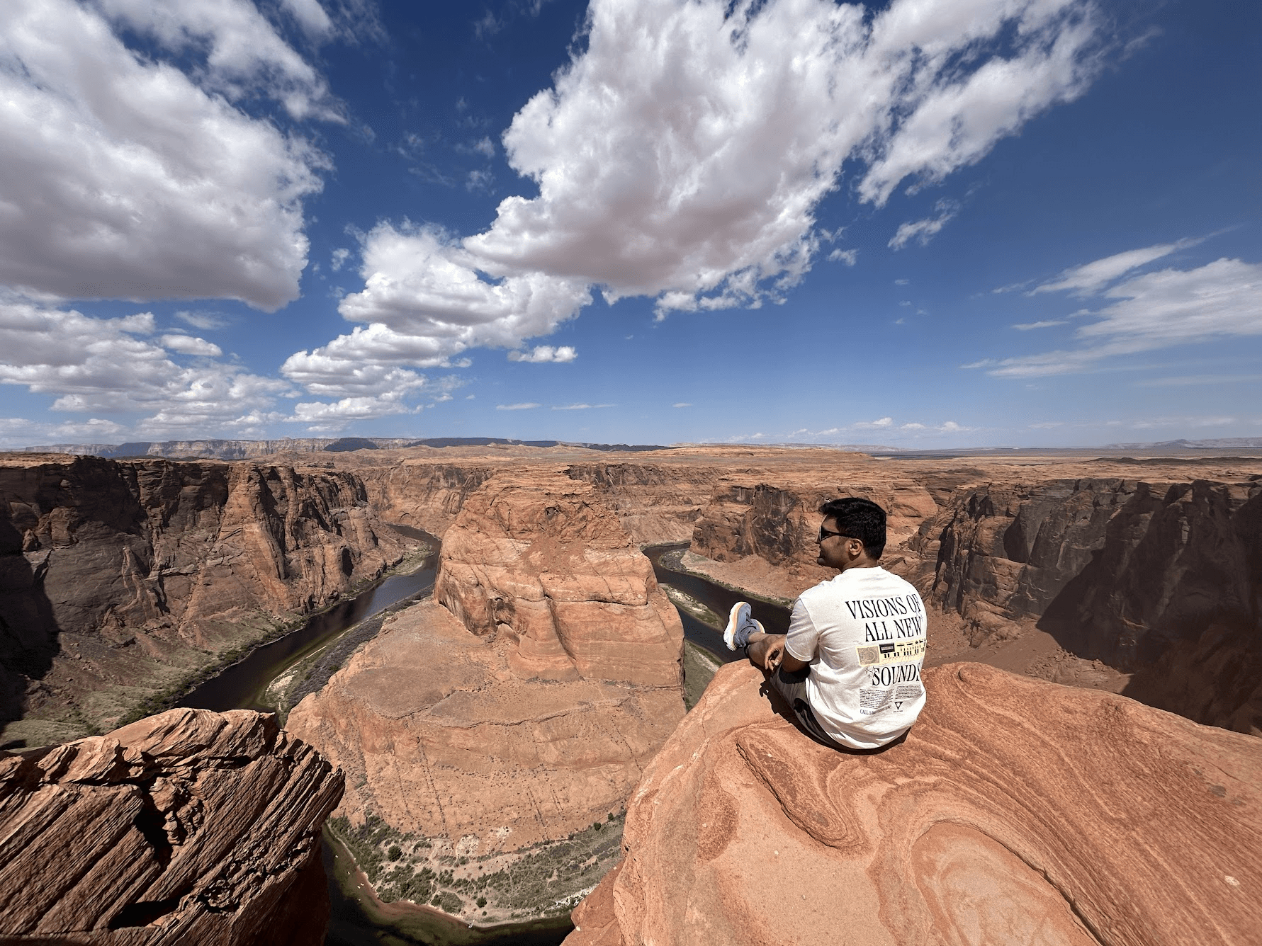man filming on beach