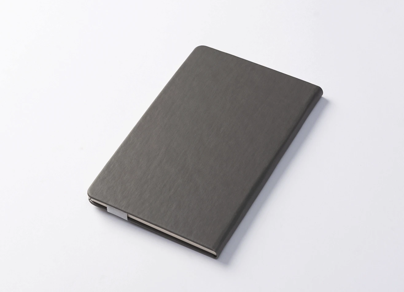 Premium executive notebook with secure magnetic strap and custom branding.