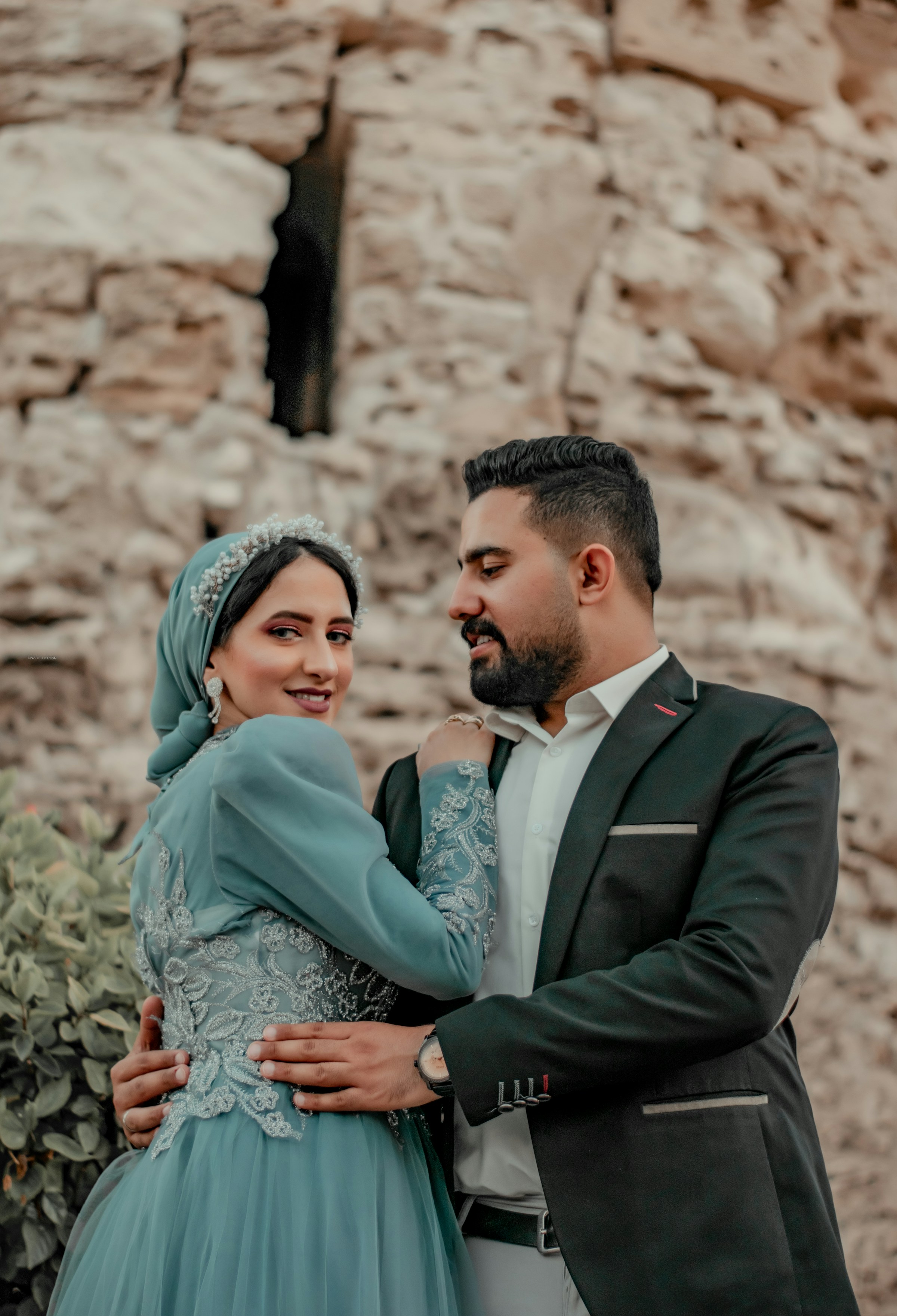 Bride and groom holding each other