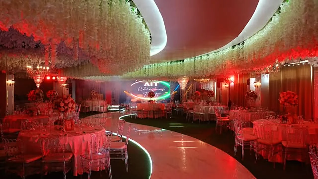 Corporate gala setup in dramatic red lighting at Celestia Hall, Stalla Suites Events Place