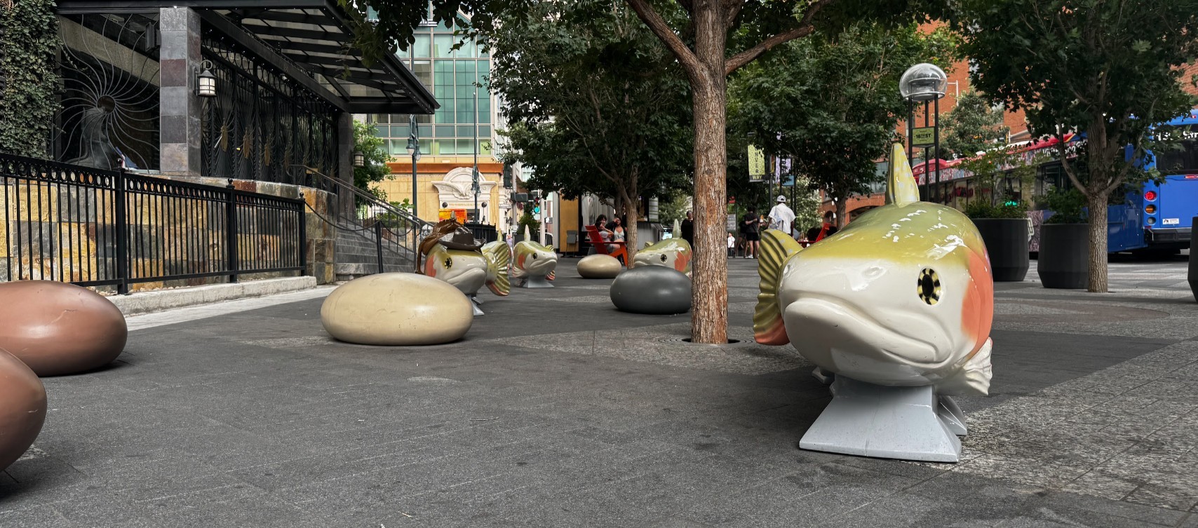 Larger than life fish sculptures lining the sidewalk of the 16th Street Mall in Denver.