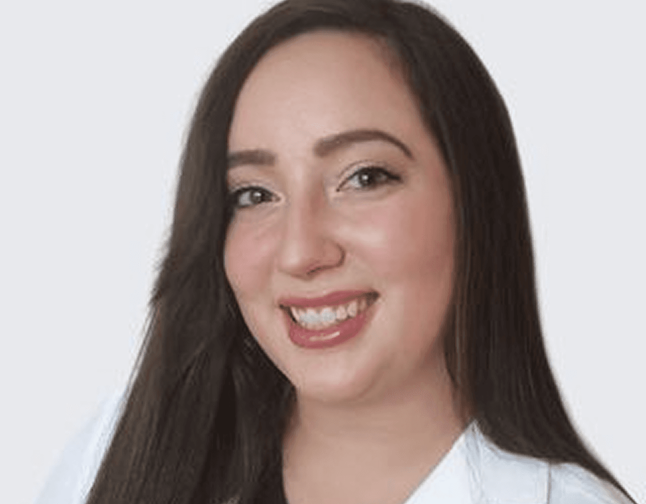 woman in blue crew neck t-shirt smiling