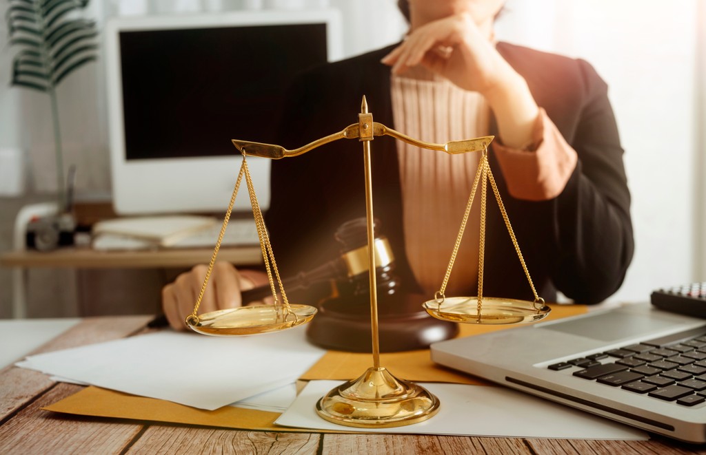 female personal injury lawyer sitting at desk