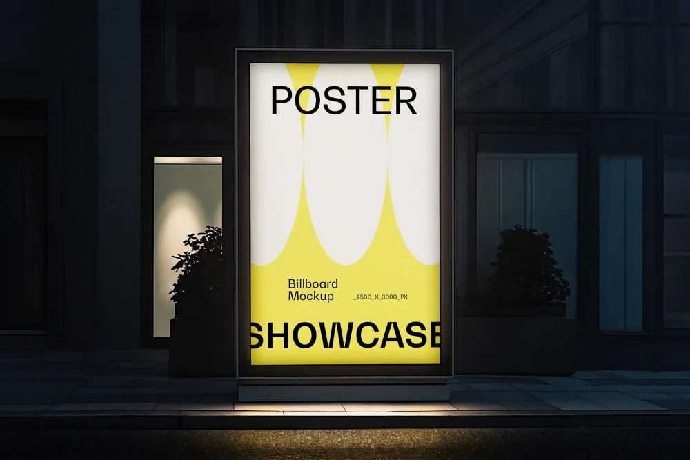 Outdoor illuminated billboard mockup with a modern design in yellow and white, displayed on a city sidewalk at night. The scene features subtle lighting and nearby building reflections.