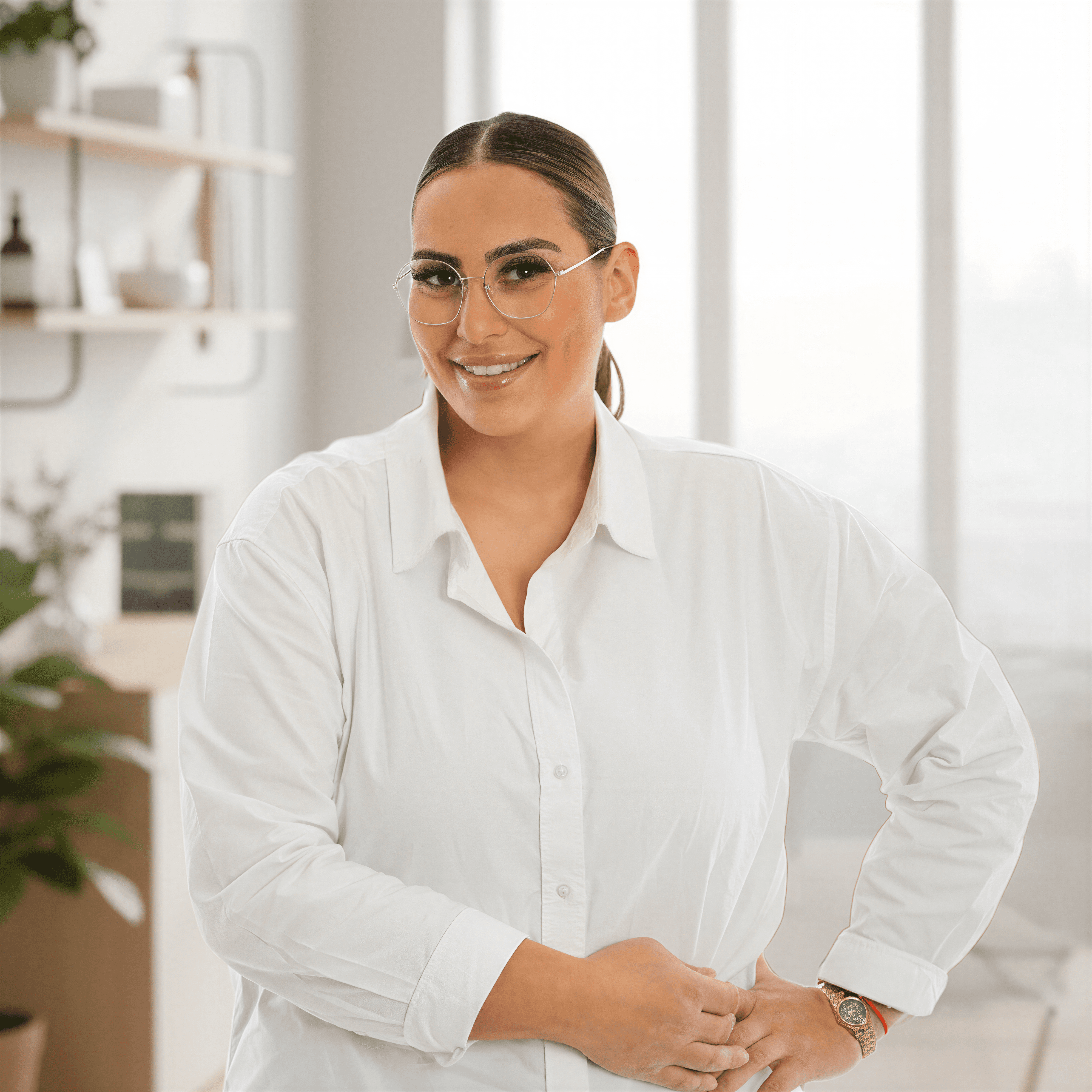 A woman holding a bouquet of flowers in a garden