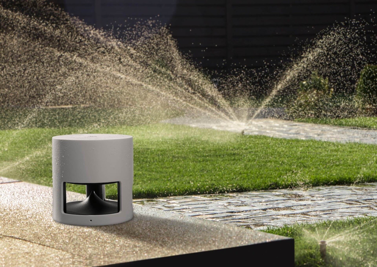 Black smart home device with screen showing time and temp