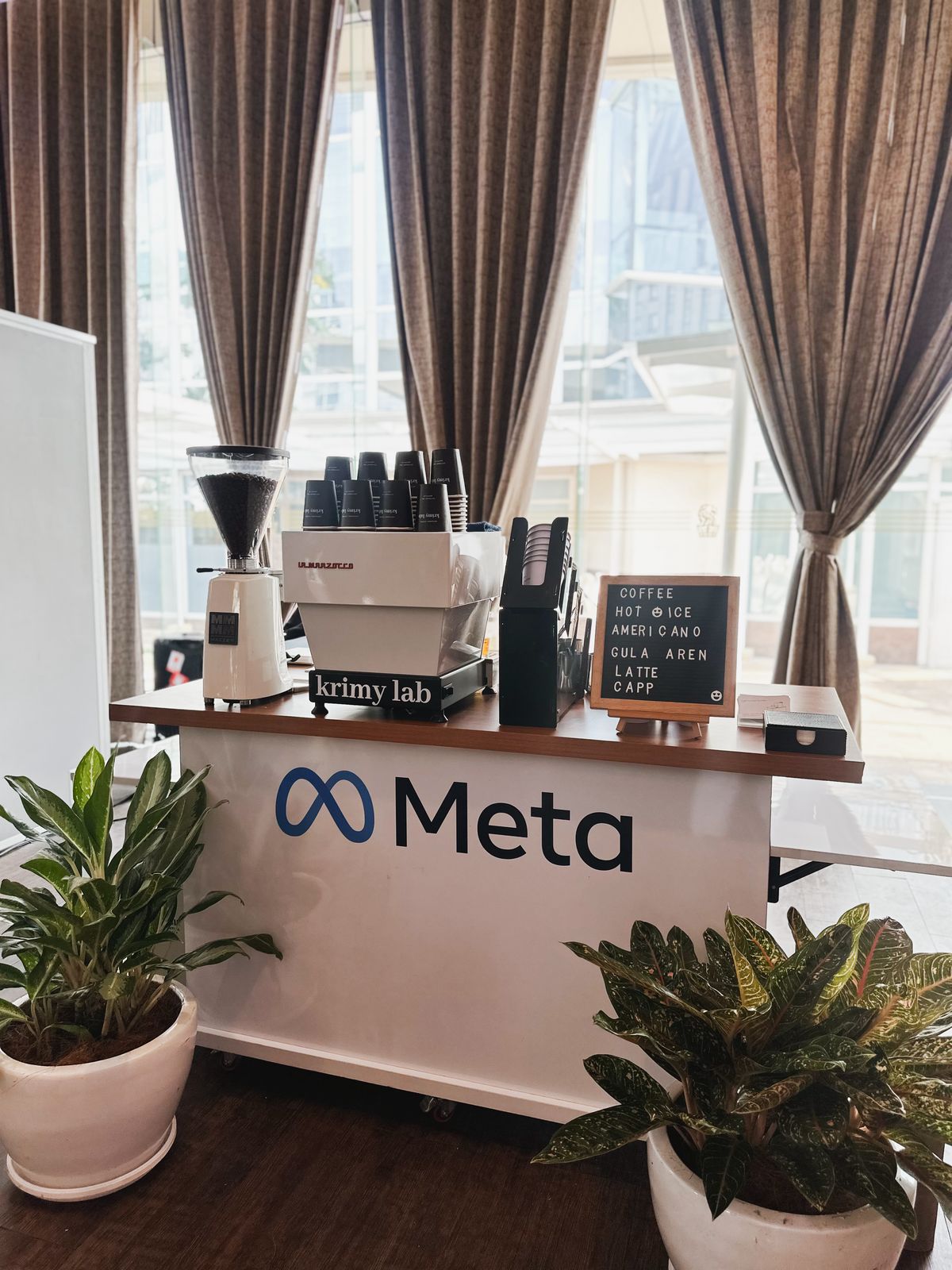 Coffee cup and bottled drink on an event service counter