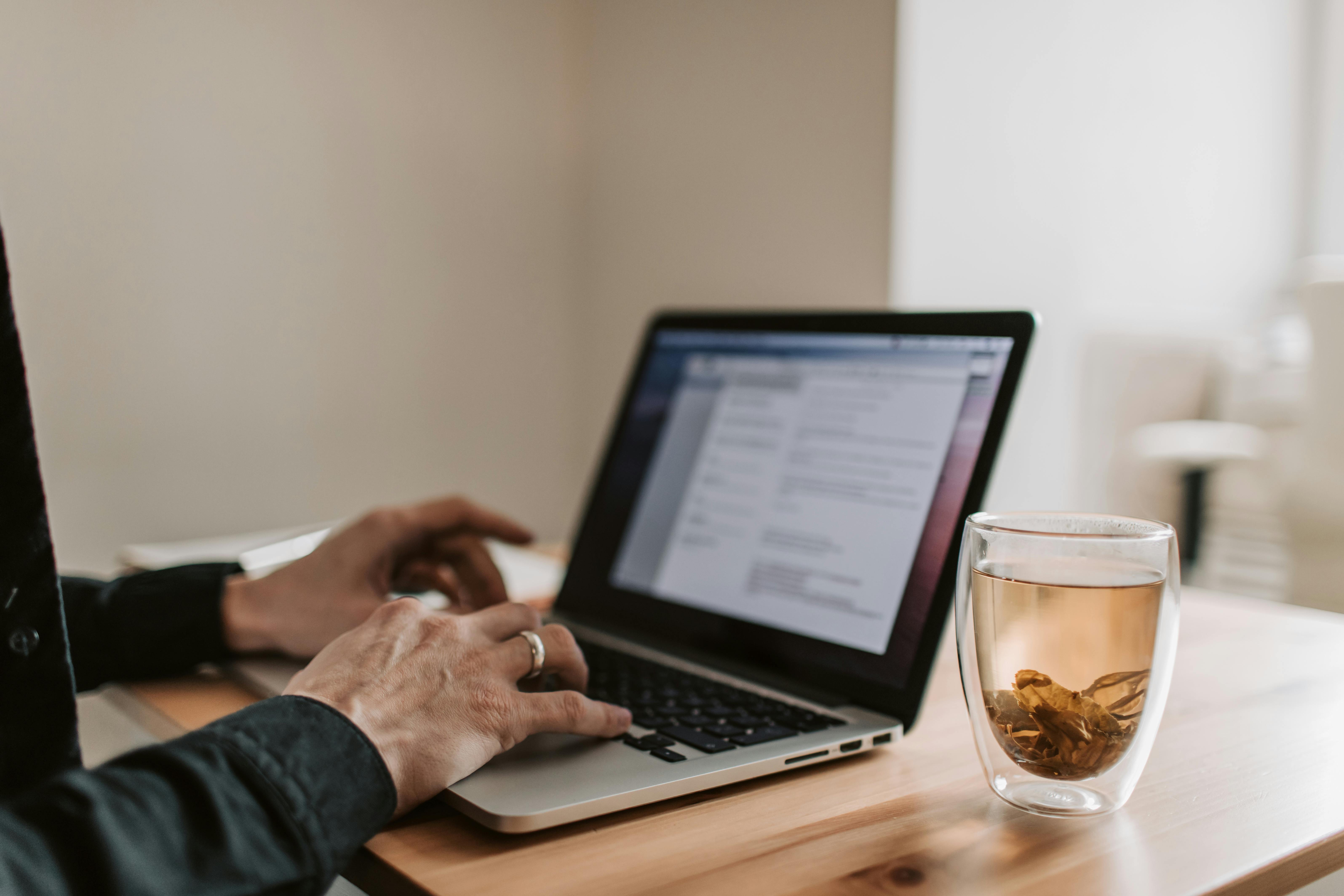 Man sending 2,000 cold emails using laptop