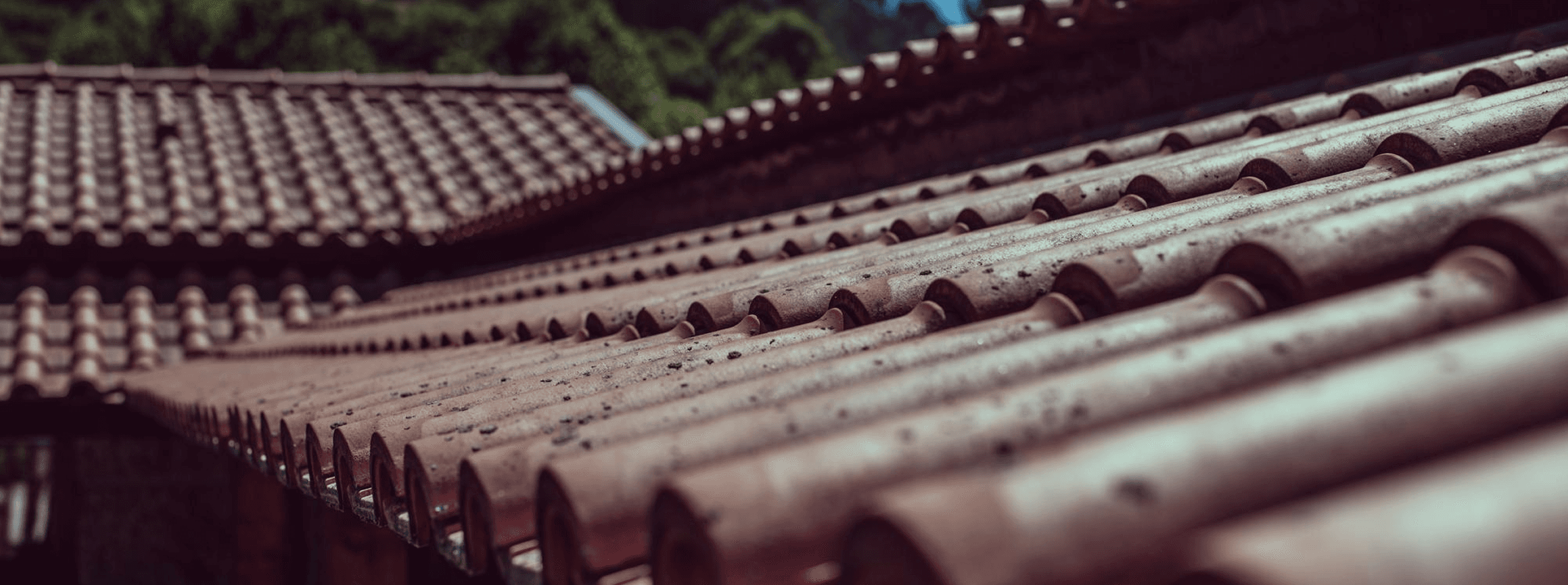 a man in a yellow shirt is working on a roof