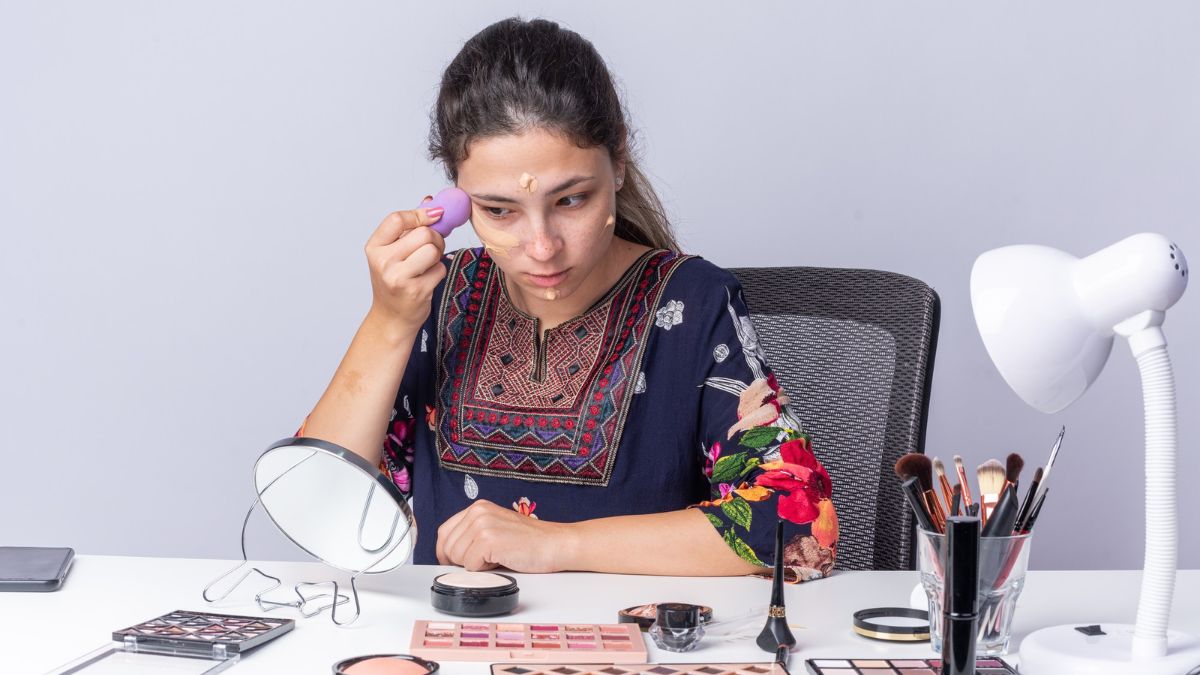Beauty creator applying makeup while demonstrating bundled cosmetics products for TikTok Shop influencer content promoting bundled product sets.