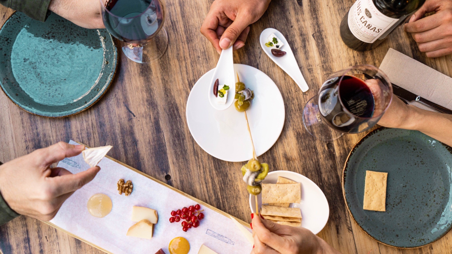 Spanish tapas and wine pairings during a Barcelona food and wine tasting experience.