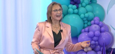 A speaker delivering a presentation at the conference.