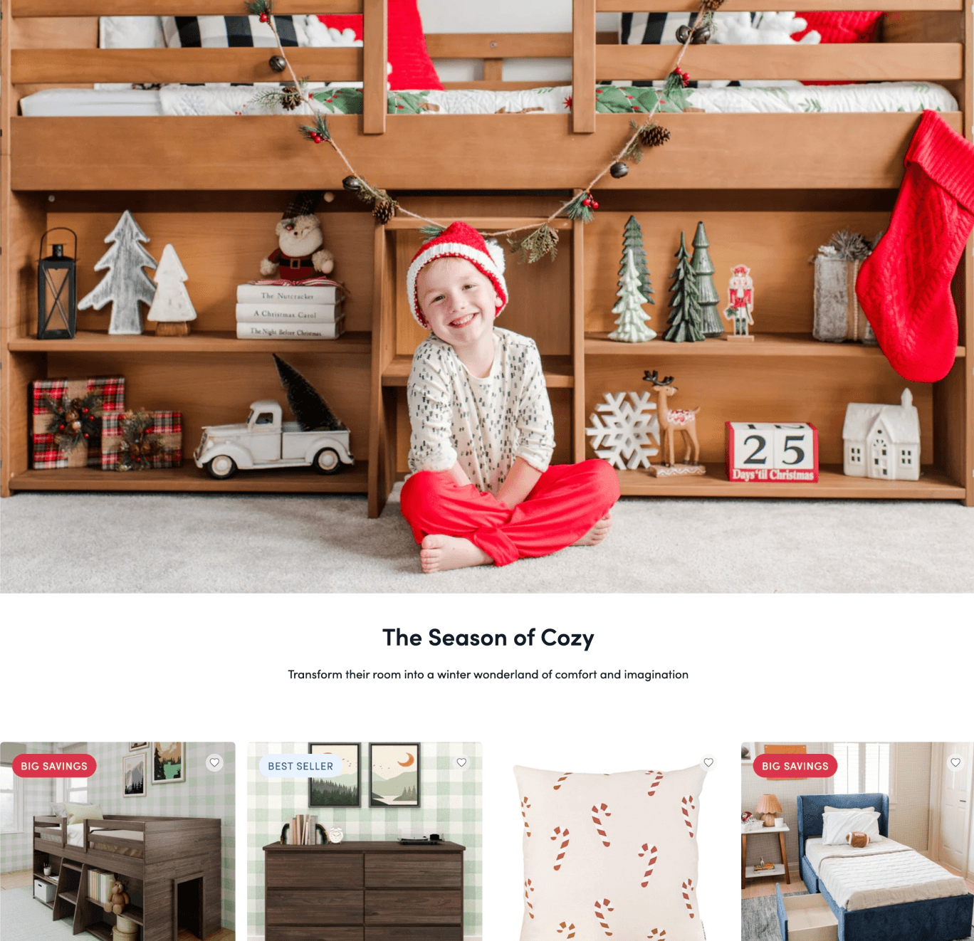 A webpage hero featuring a child wearing holiday themed clothing sitting in front of a wooden bed with storage shelves under it. Lining the shelves are various holiday decorations such as trees, gift boxes, a toy truck, and a wooden block calendar. 