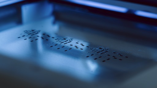 A detailed close-up shot of a machine, clearly showing its surface texture.