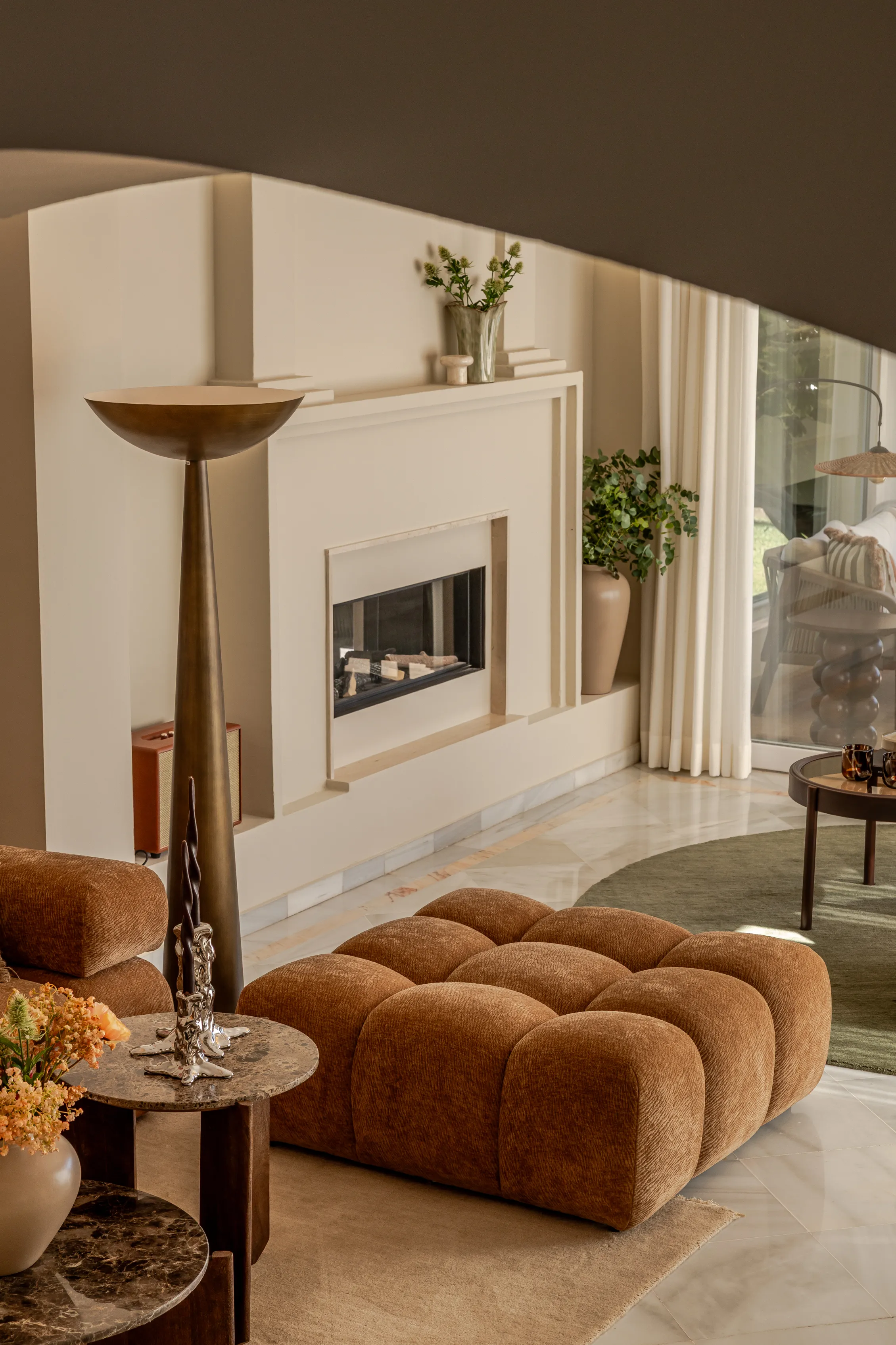 Mediterranean-inspired living room with bespoke furniture and warm natural materials.