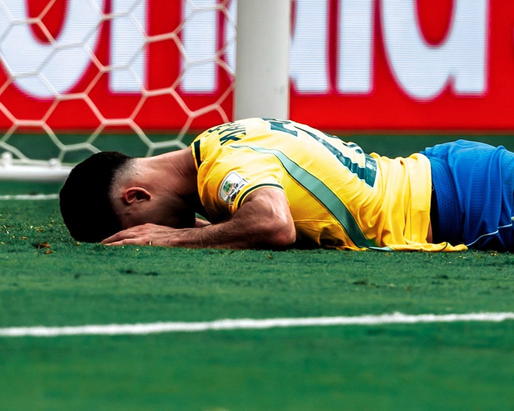 A Brazil player lies face down on the turf near the goal after Norway's Round of 16 victory