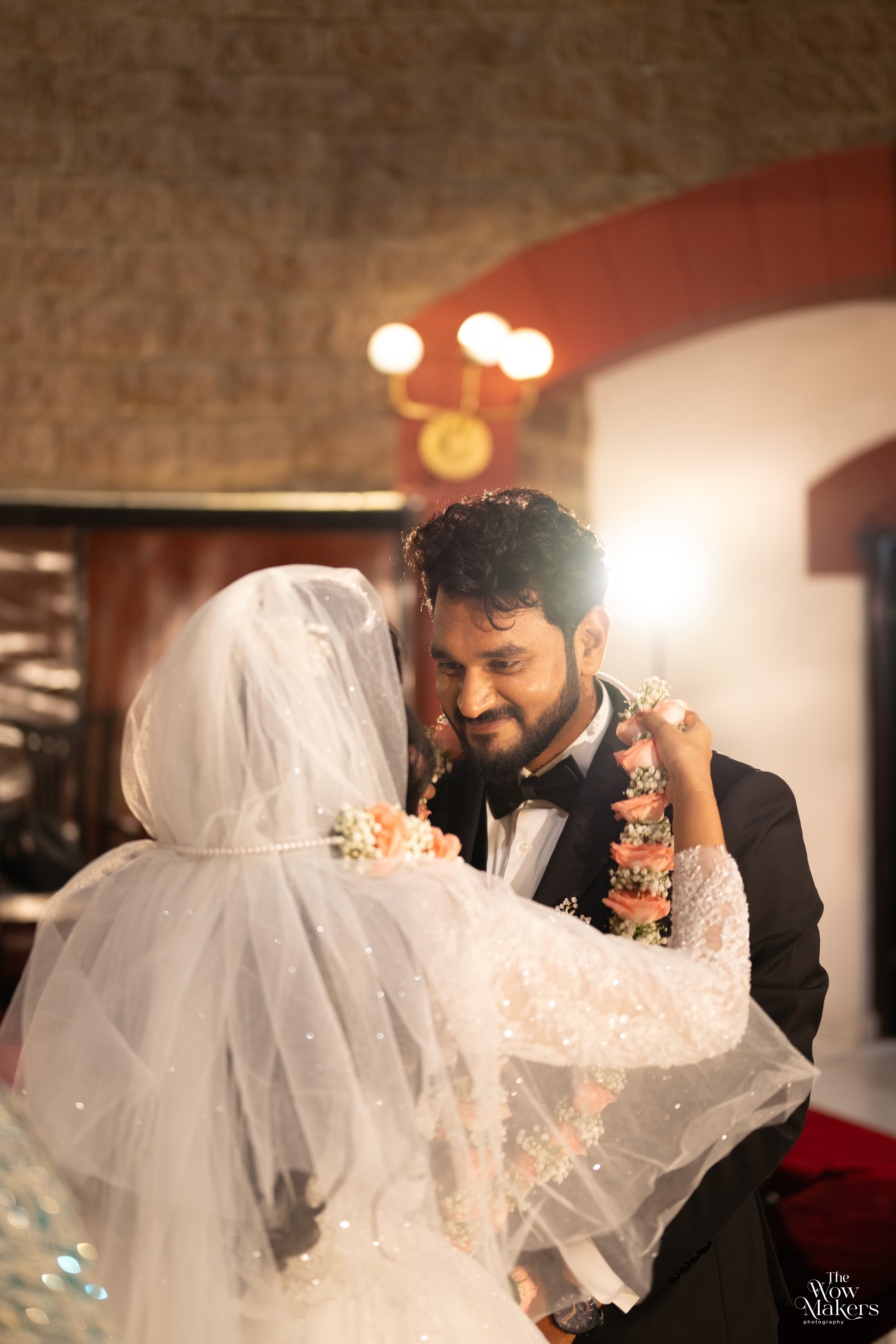 Christian wedding ceremony with bride in white gown and veil, photographed by Wow Makers wedding photography in Hyderabad, India.