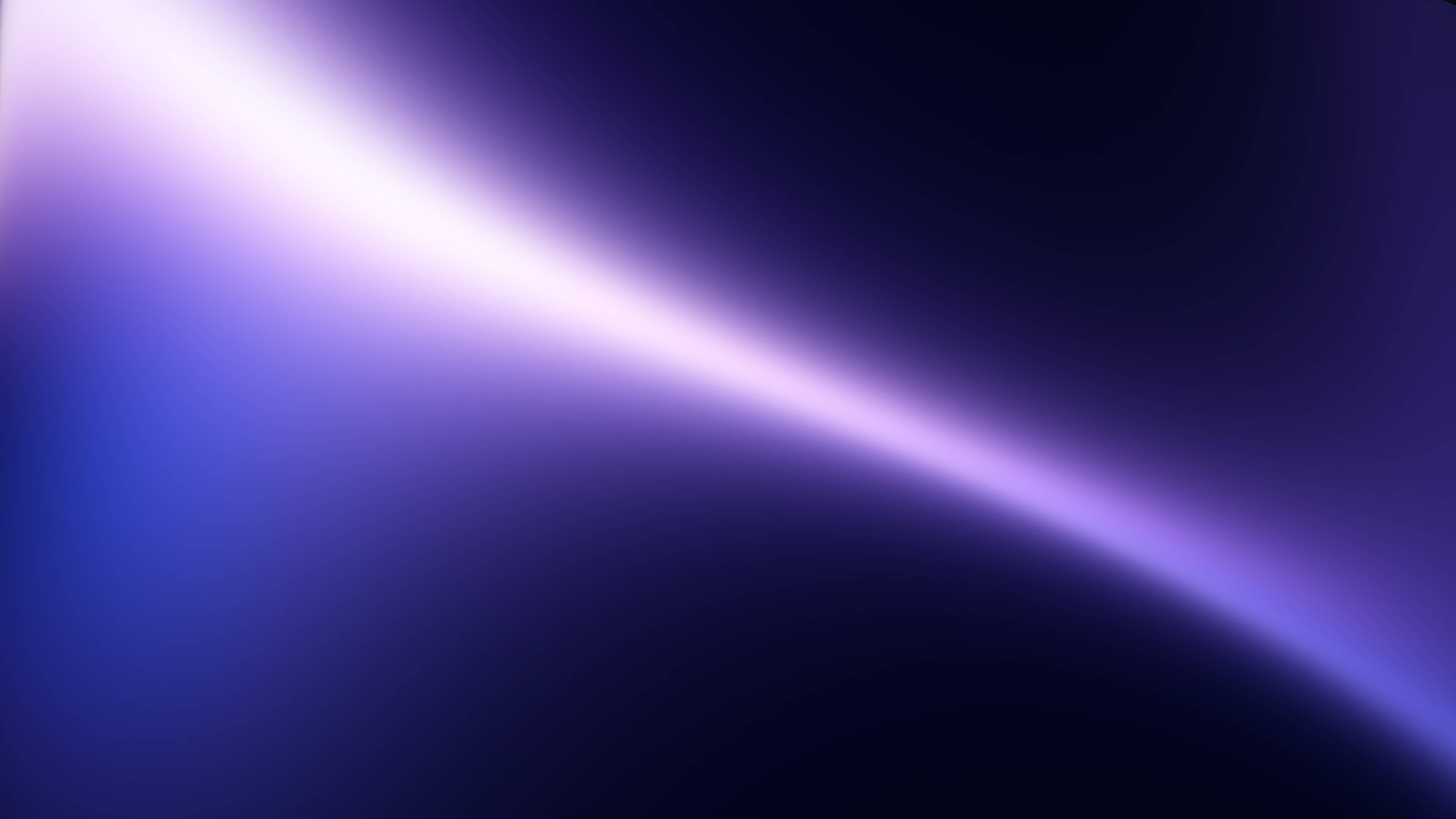 A blurred background with blue, purple, and pink colors