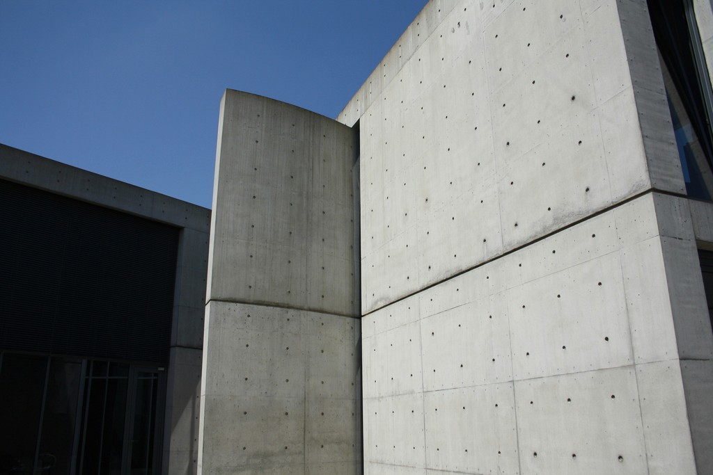 a concrete structure set against a backdrop of clear blue sky