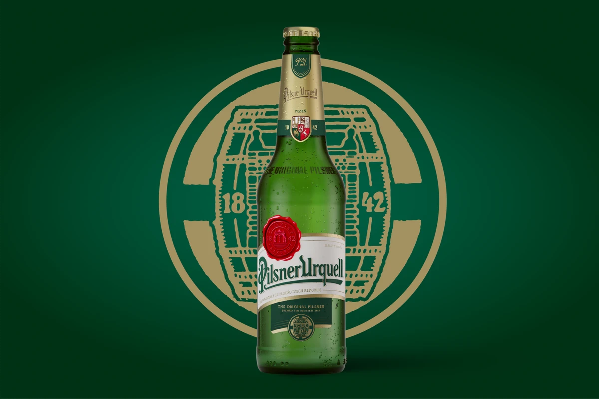 Pilsner Urquell bottle in front of logo