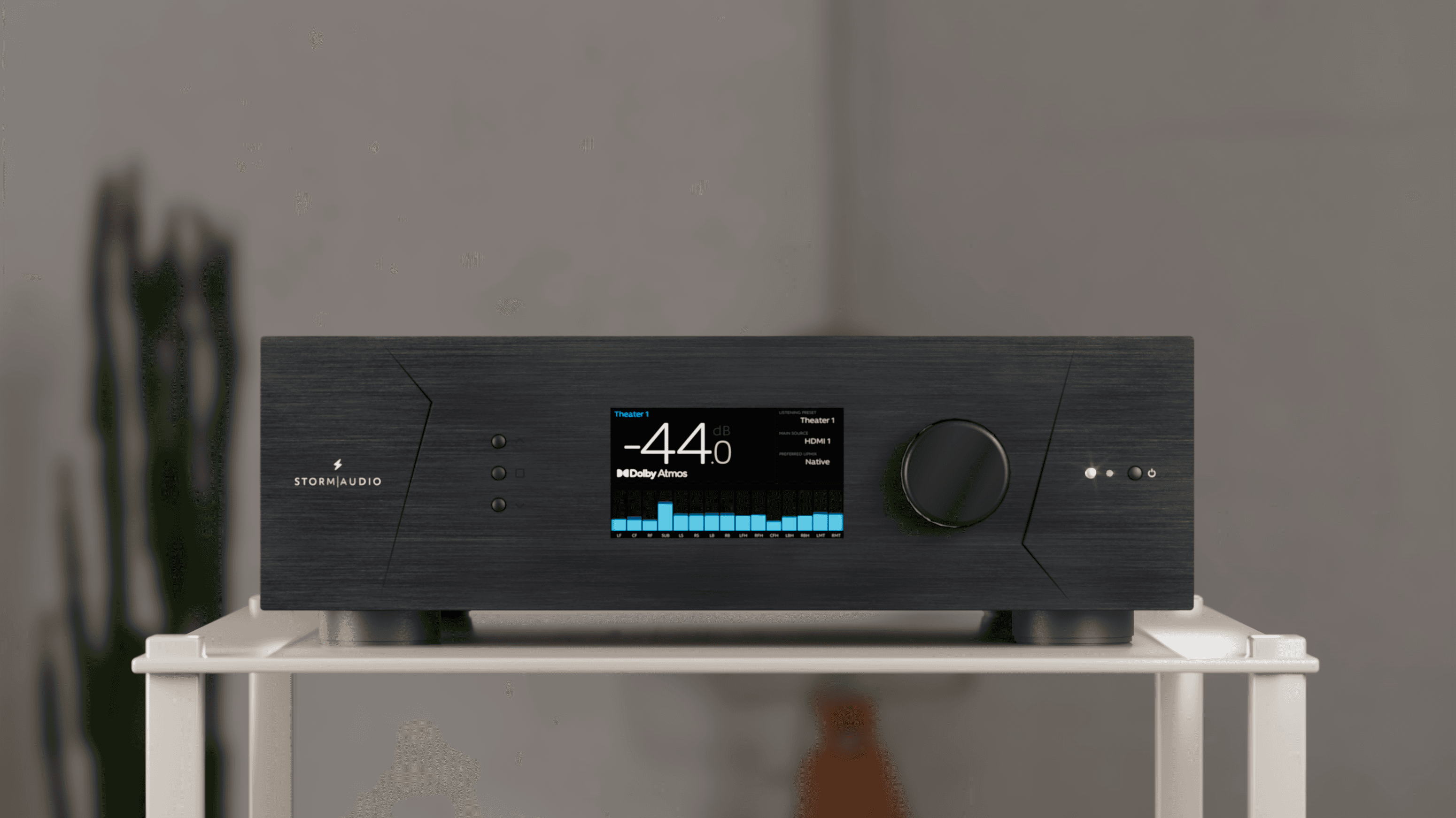 StormAudio AV processor display showing volume and Dolby Atmos.