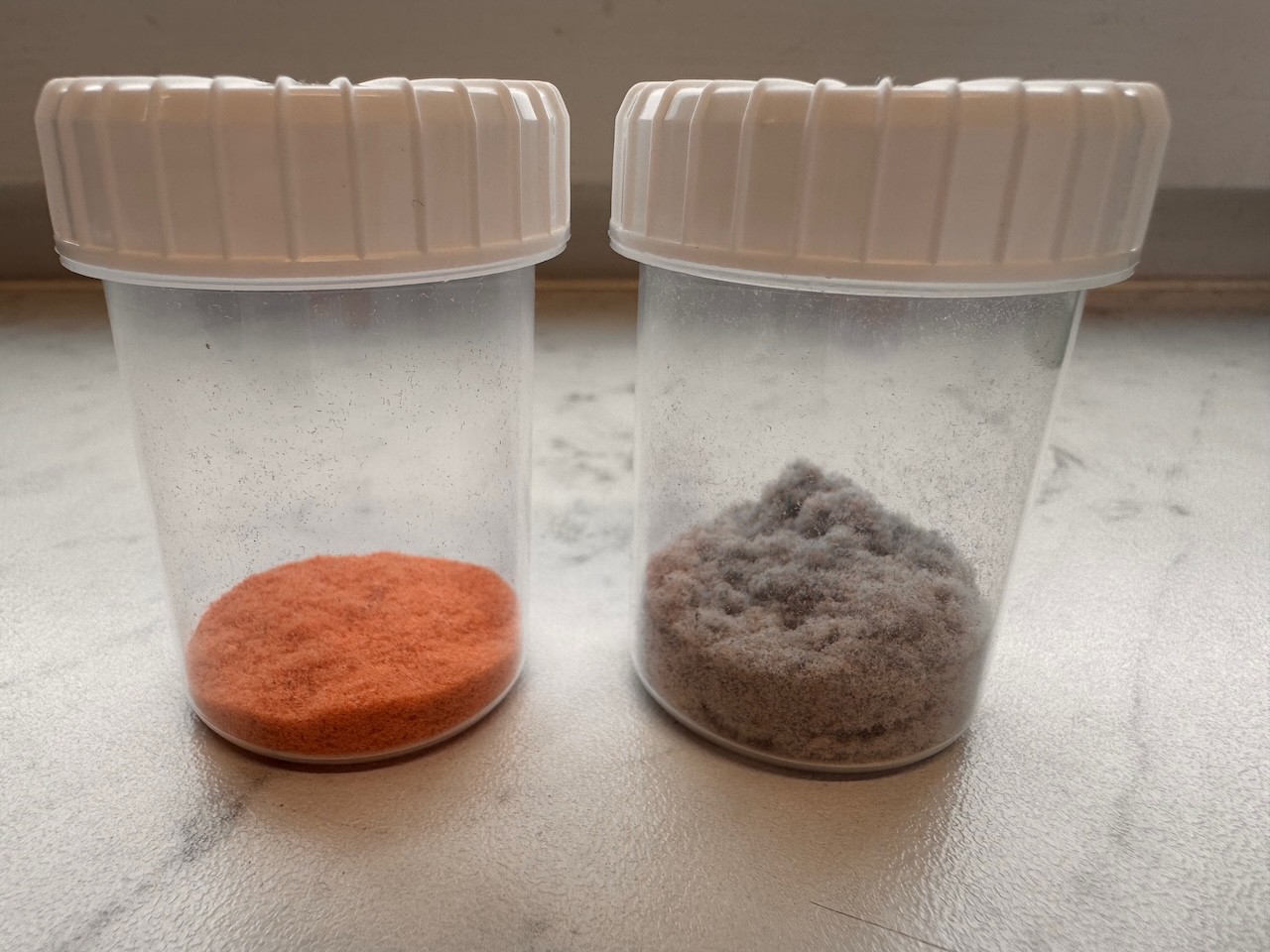 Sorted orange and grey fiber material