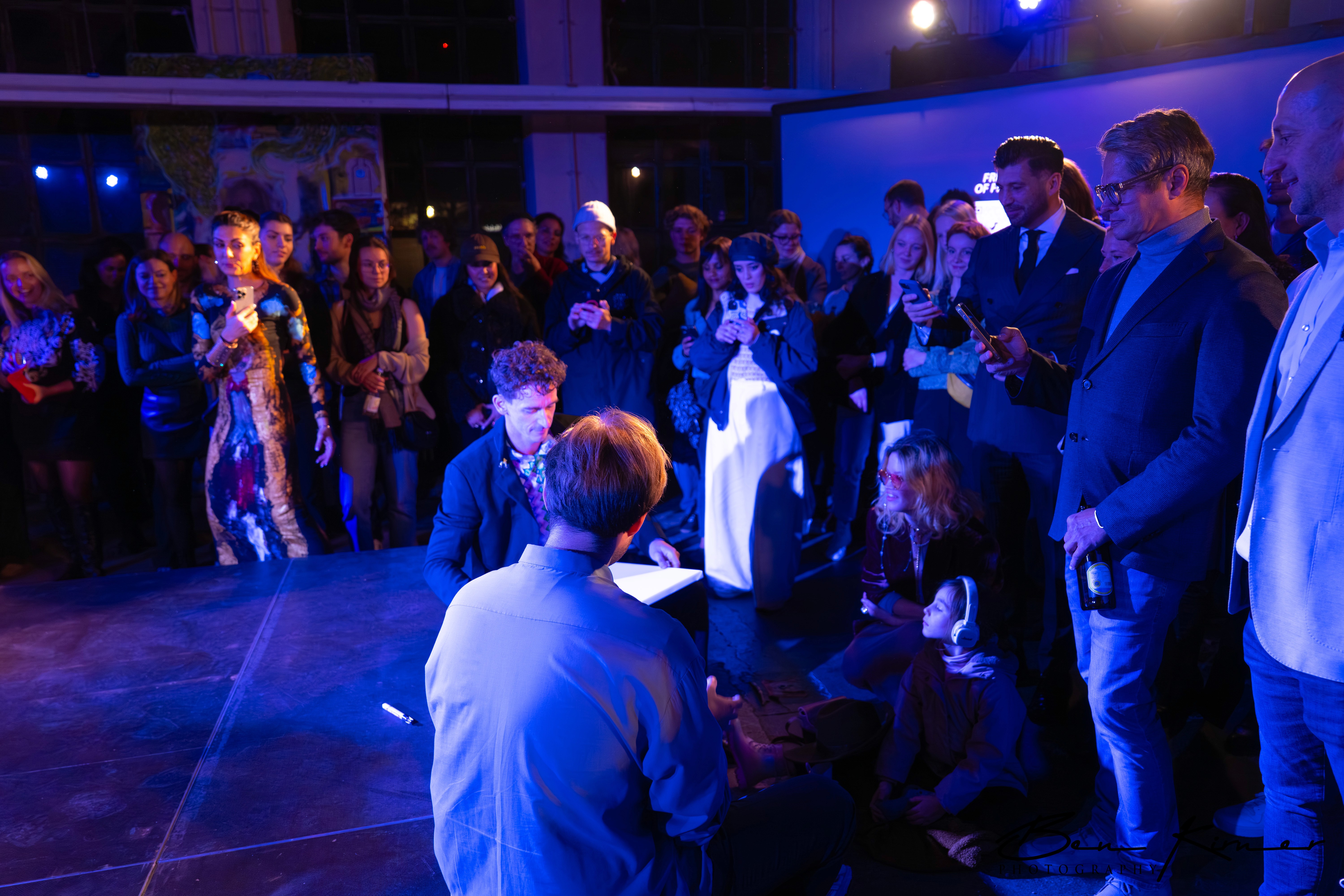 Entrepreneurs engaging in a lively discussion during a Bizz Buzz networking event.